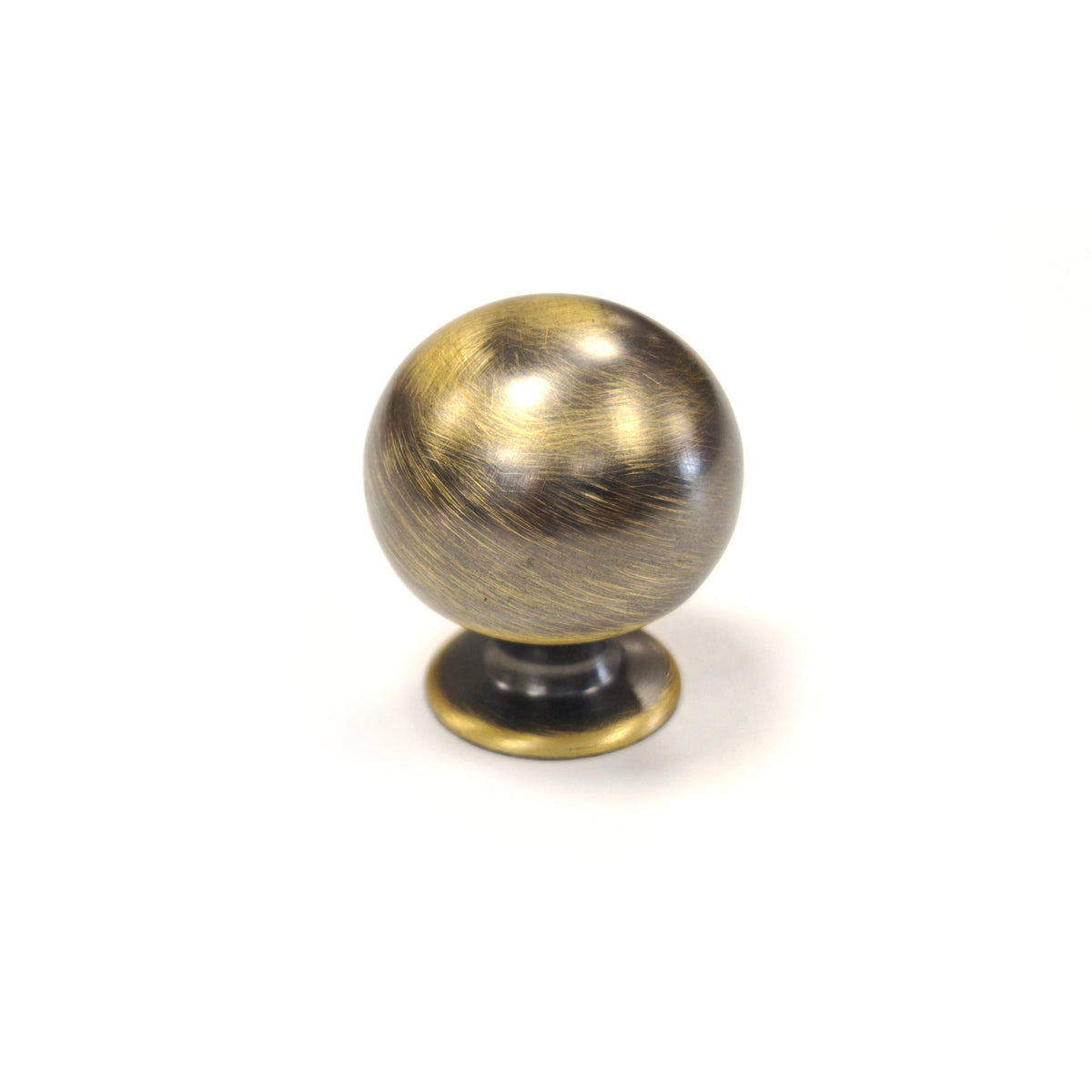 Antique aged brass spherical ball drawer knob with hand-burnished dark patina finish on a white background