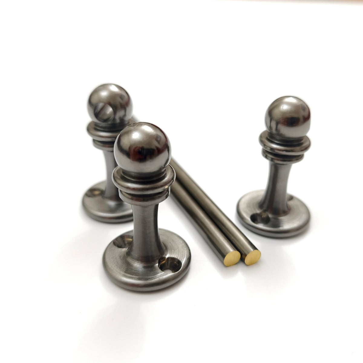 Handcrafted solid brass gallery rail system components in Black Shadow finish showing three support posts and two brass rods on a white background.
