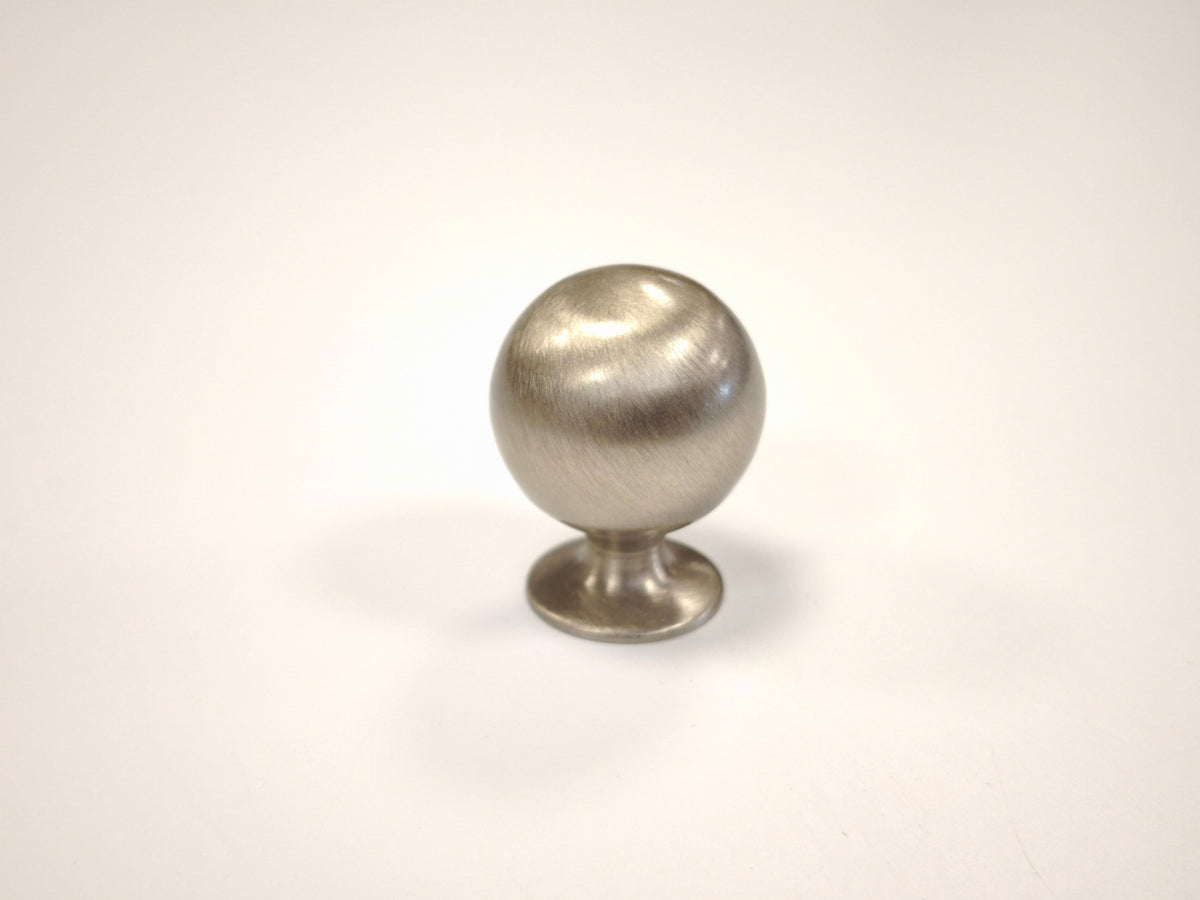 Brushed satin nickel spherical ball drawer knob on a white background for cabinets and dressers.
