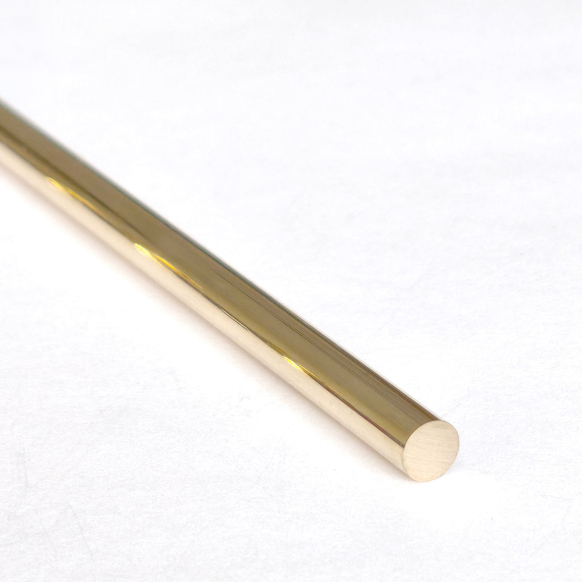 Brass Gallery Rail raw solid brass round rod for shelf gallery rails, close-up view on a clean white background showing polished golden brass surface.