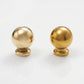 Side-by-side comparison of an unlacquered solid brass ball knob showing new polished finish on the left and natural aged patina development after a few months on the right.