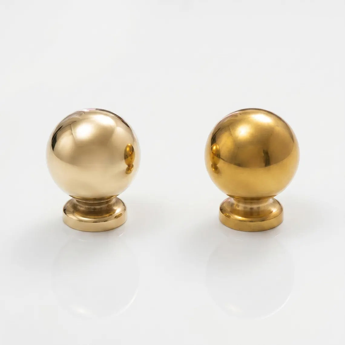 Side-by-side comparison of an unlacquered solid brass ball knob showing new polished finish on the left and natural aged patina development after a few months on the right.
